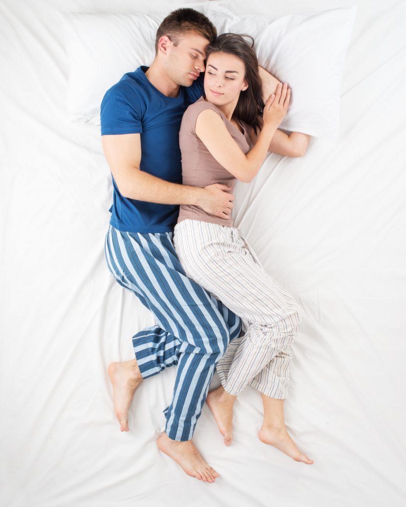 Couple sleeping in a spooning position
